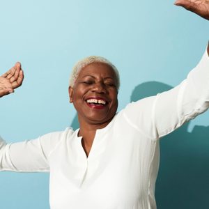 woman laughing and dancing