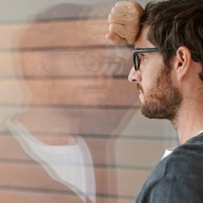 fears and anxiety man looking out window