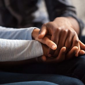 close up of couple holding hands