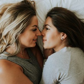 Lesbian couple together in bed