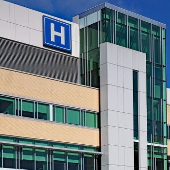 Modern style building with large H sign for hospital