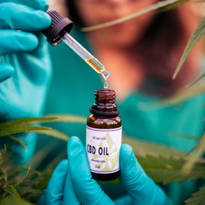 CBD oil tincture in woman's hands