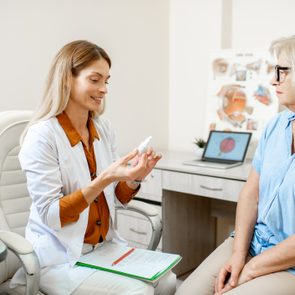 Senior patient with ophthalmologist in the office