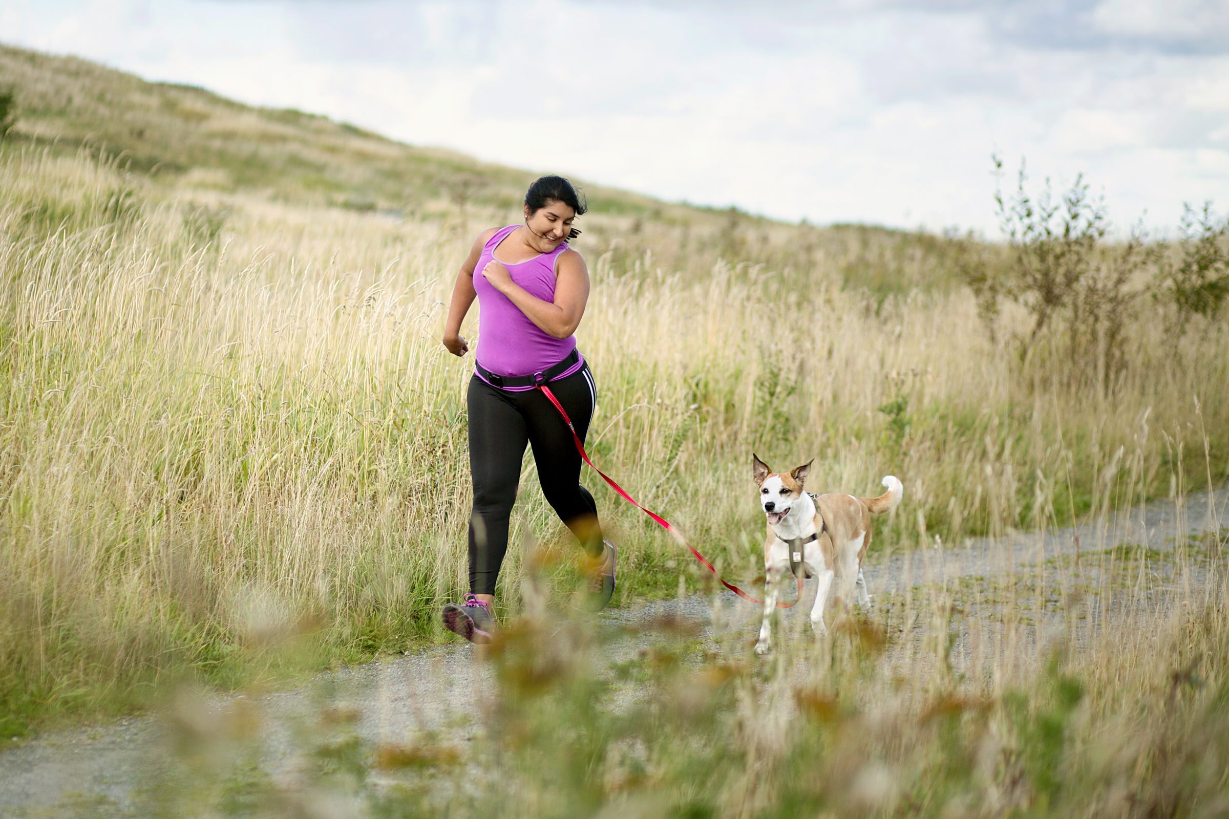 Is It Safe for Your Dog to Run (or Bike) With You? Here’s the Farthest Experts Say You Should Go